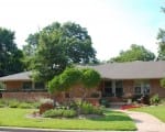 Color, texture, hardscapes, and repeating elements help add curb appeal Curb appeal update for older Oak Cliff, Texas home