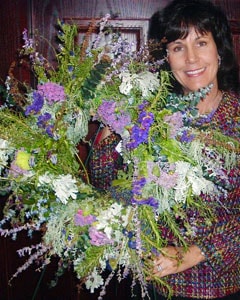 Carrie with fresh herb wreath